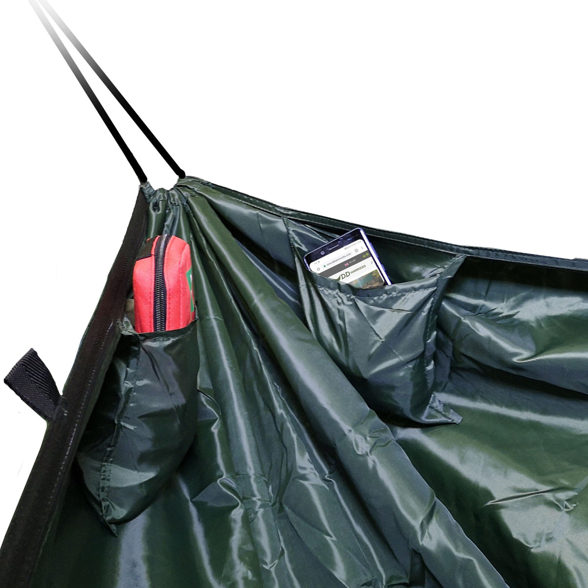 Innsiden av DD Camping Hammock med to lommer, den ene med en mobiltelefon
